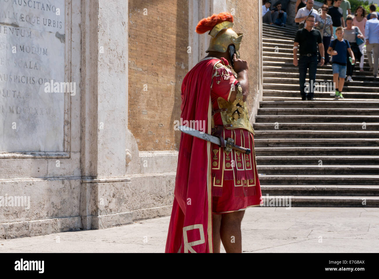 Italy: Roman legionary with smartphone at Spanish Steps in Rome . Photo from 5th September 2014. Stock Photo