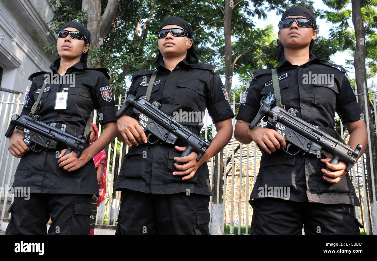 Dhaka, Bangladesh during a verdict announcement. 17th Sep, 2014. Members of Rapid Action Battalion (RAB) stand guard in front of the Supreme Court in Dhaka, Bangladesh during a verdict announcement, Sept. 17, 2014. Bangladesh's top court on Wednesday commuted the death sentence of an Islamist party leader convicted of war crimes to life imprisonment. Credit:  Shariful Islam/Xinhua/Alamy Live News Stock Photo