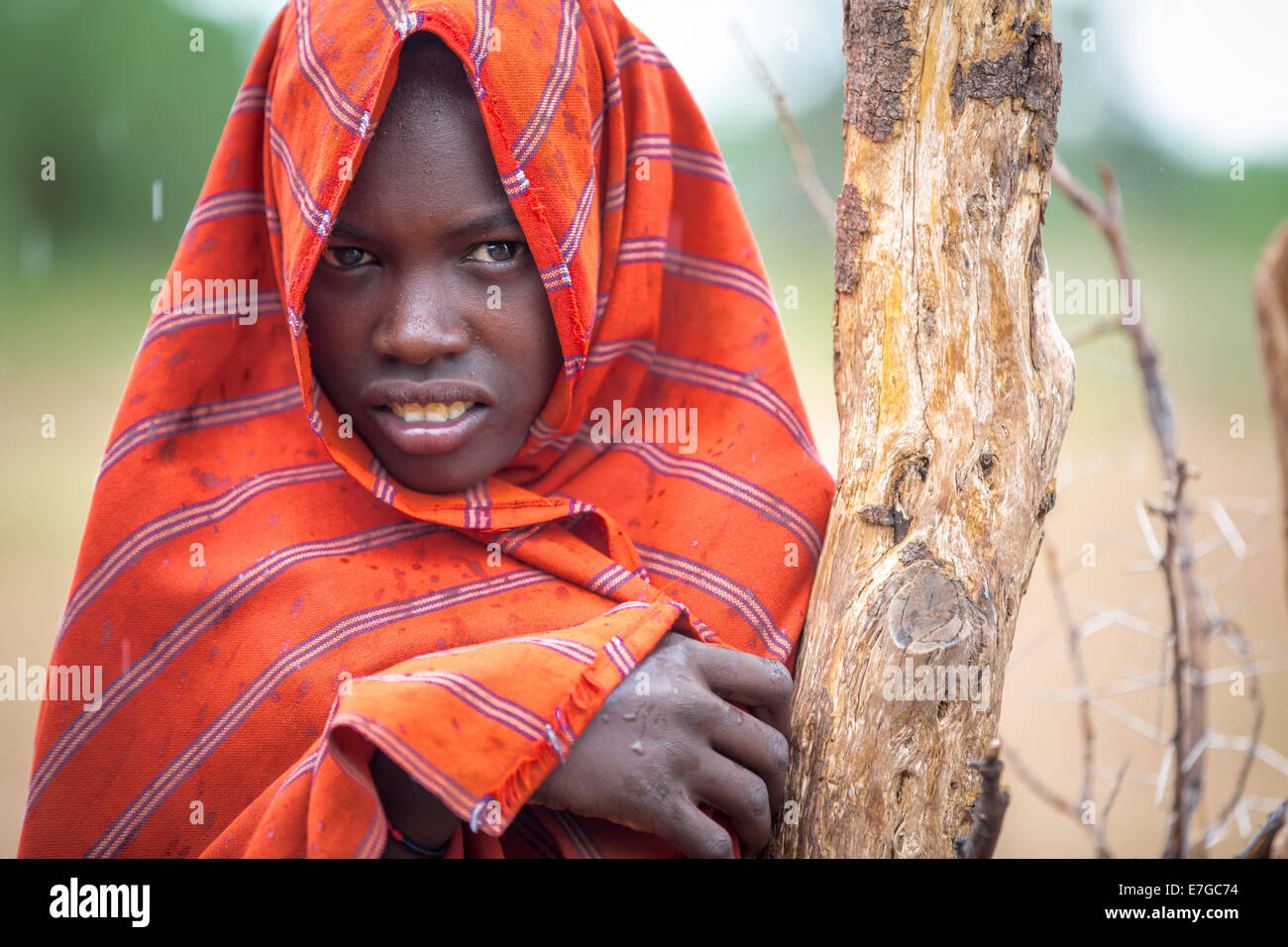 Dassanetch girl in southern Ethiopia in rain, Ethiopia 13 May 2014. Stock Photo