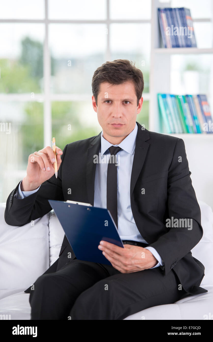 Portrait of male psychologist in his office Stock Photo Alamy