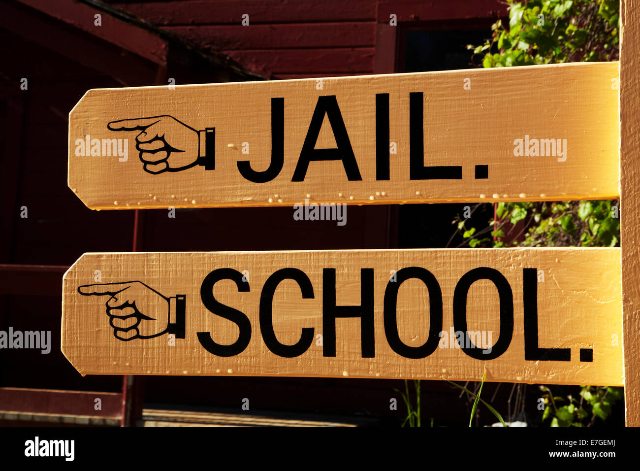 Sign to jail and school, Columbia State Historic Park, Columbia, Tuolumne County, Sierra Nevada foothills, California, USA Stock Photo