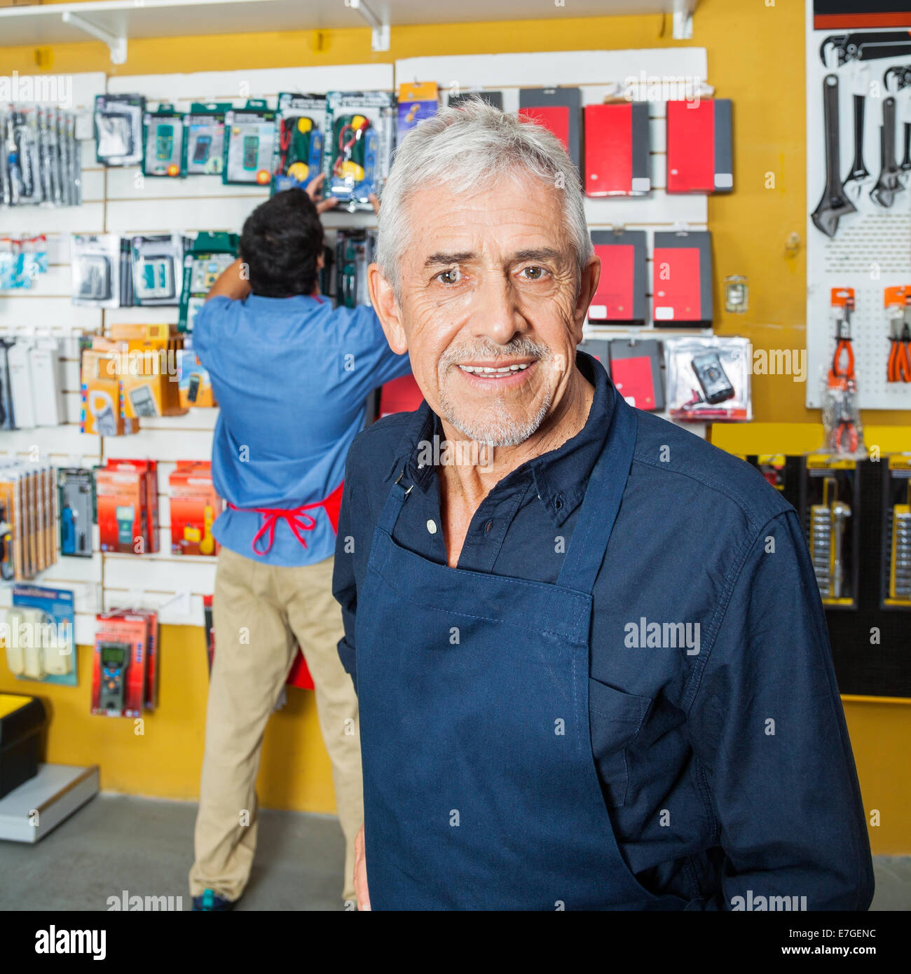 Confident Senior Worker Smiling In Hardware Store Stock Photo Alamy