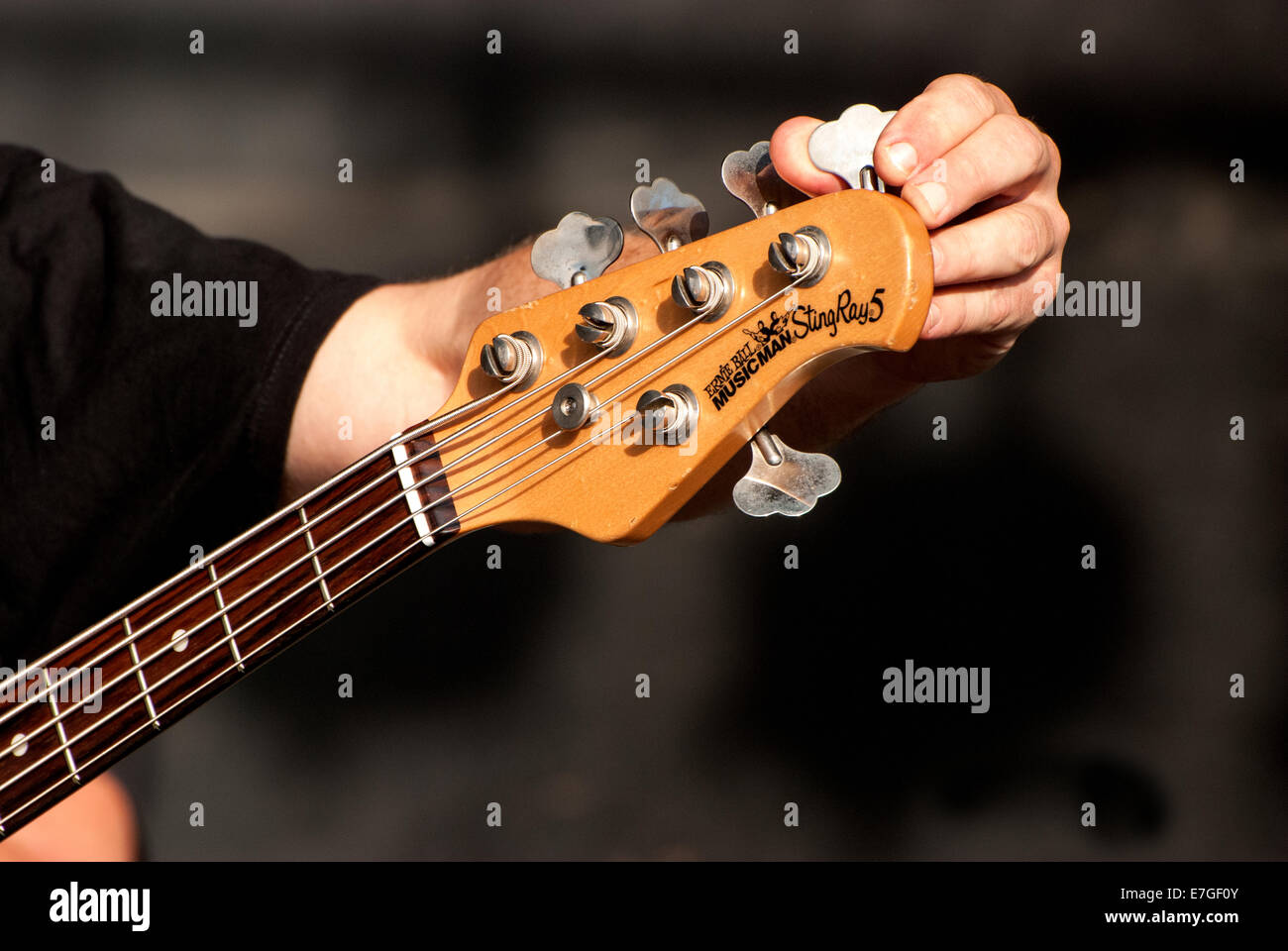 Tuning a guitar Stock Photo
