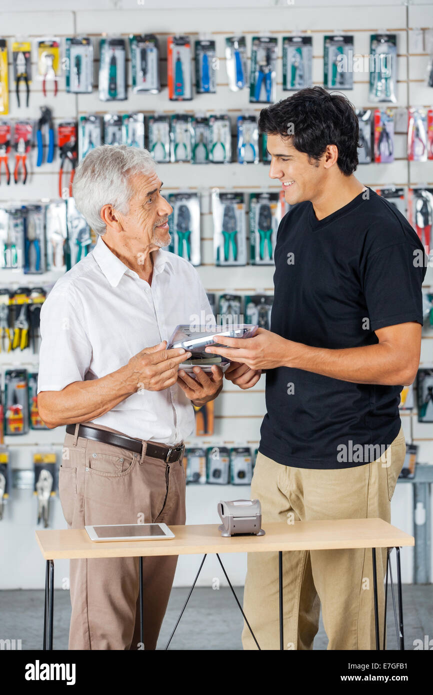 Father And Son Buying Tools In Store Stock Photo