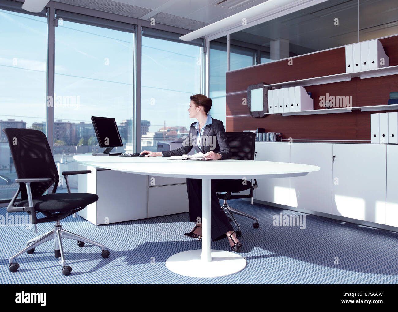 businesswoman working in her office Stock Photo - Alamy