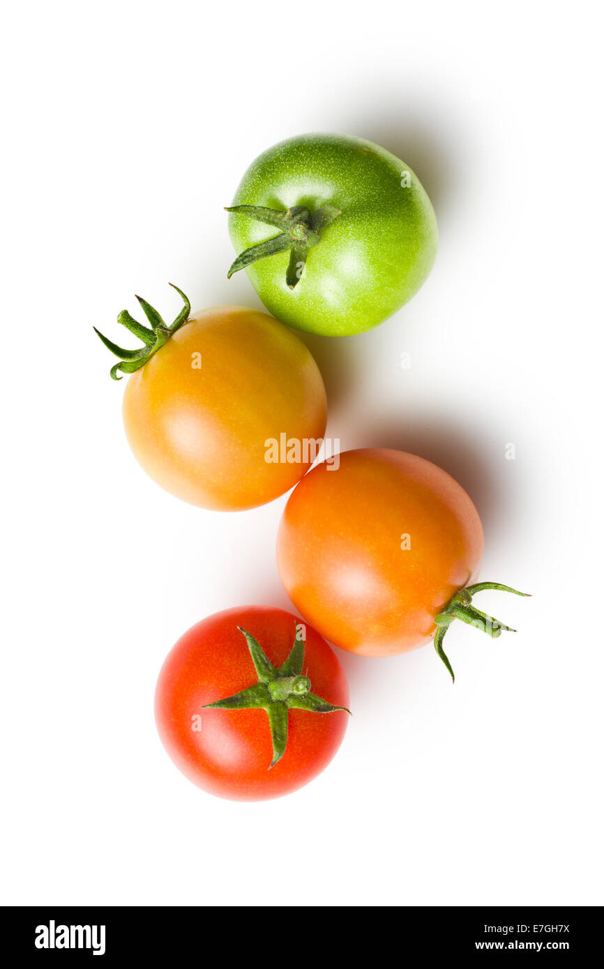 green and red tomatoes on white background Stock Photo - Alamy