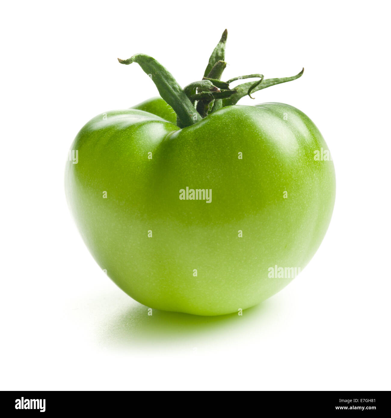 green tomato on white background Stock Photo - Alamy