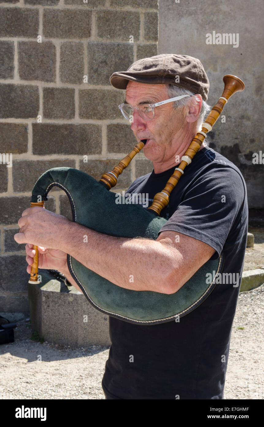 Traditional Breton folk bagpipe musician Stock Photo