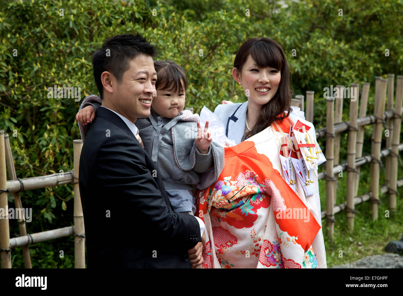 Japanese people, family with husband, wife, child posing for picture. Maruyama-koen park, Kyoto, Japan, Asia Stock Photo