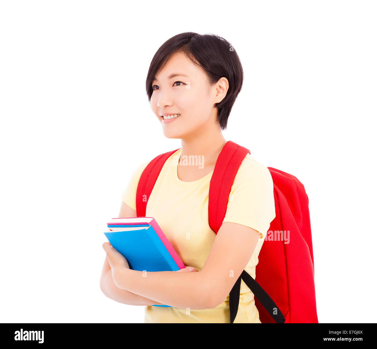 young student girl standing and holding book over white background ...