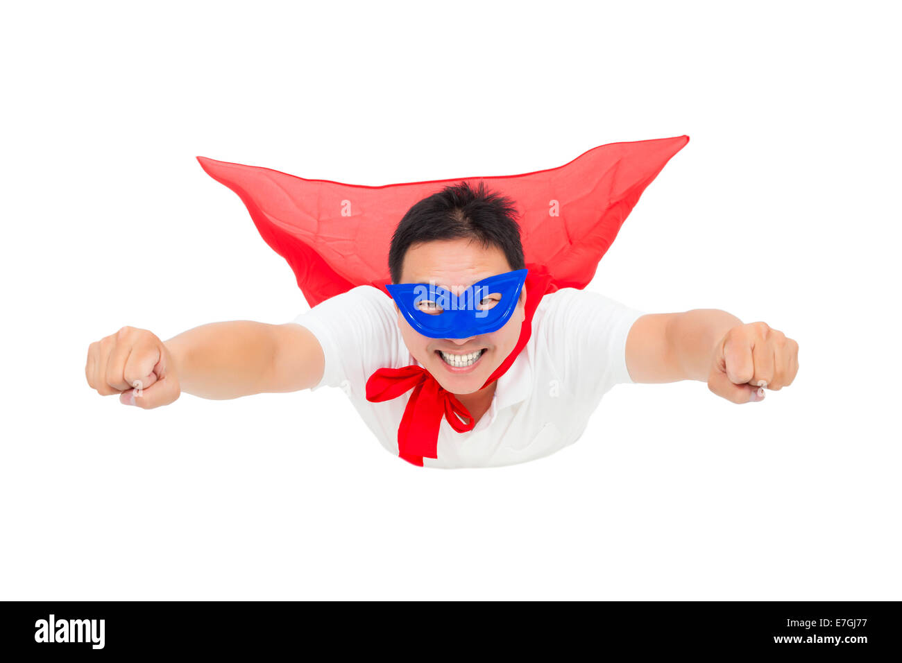 superman flying with red cape. isolated on white background Stock Photo