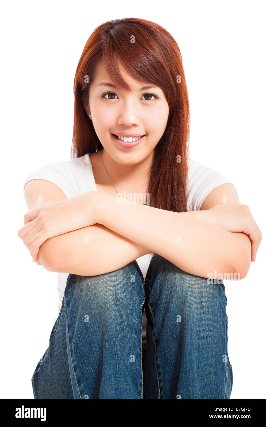 attractive beautiful young woman sitting on the floor Stock Photo - Alamy