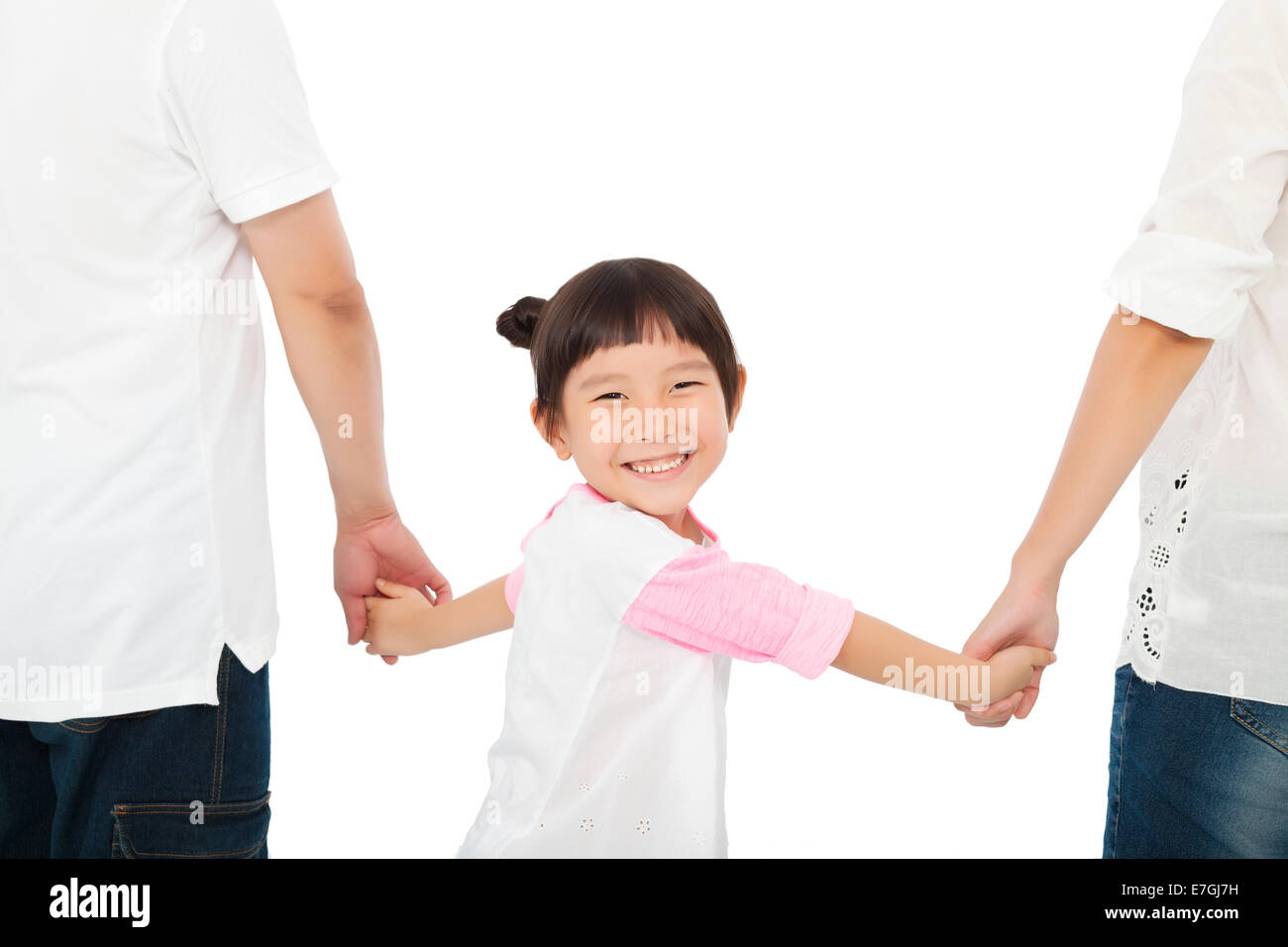 happy little girl hold parents hands and smiling . isolated on white background Stock Photo