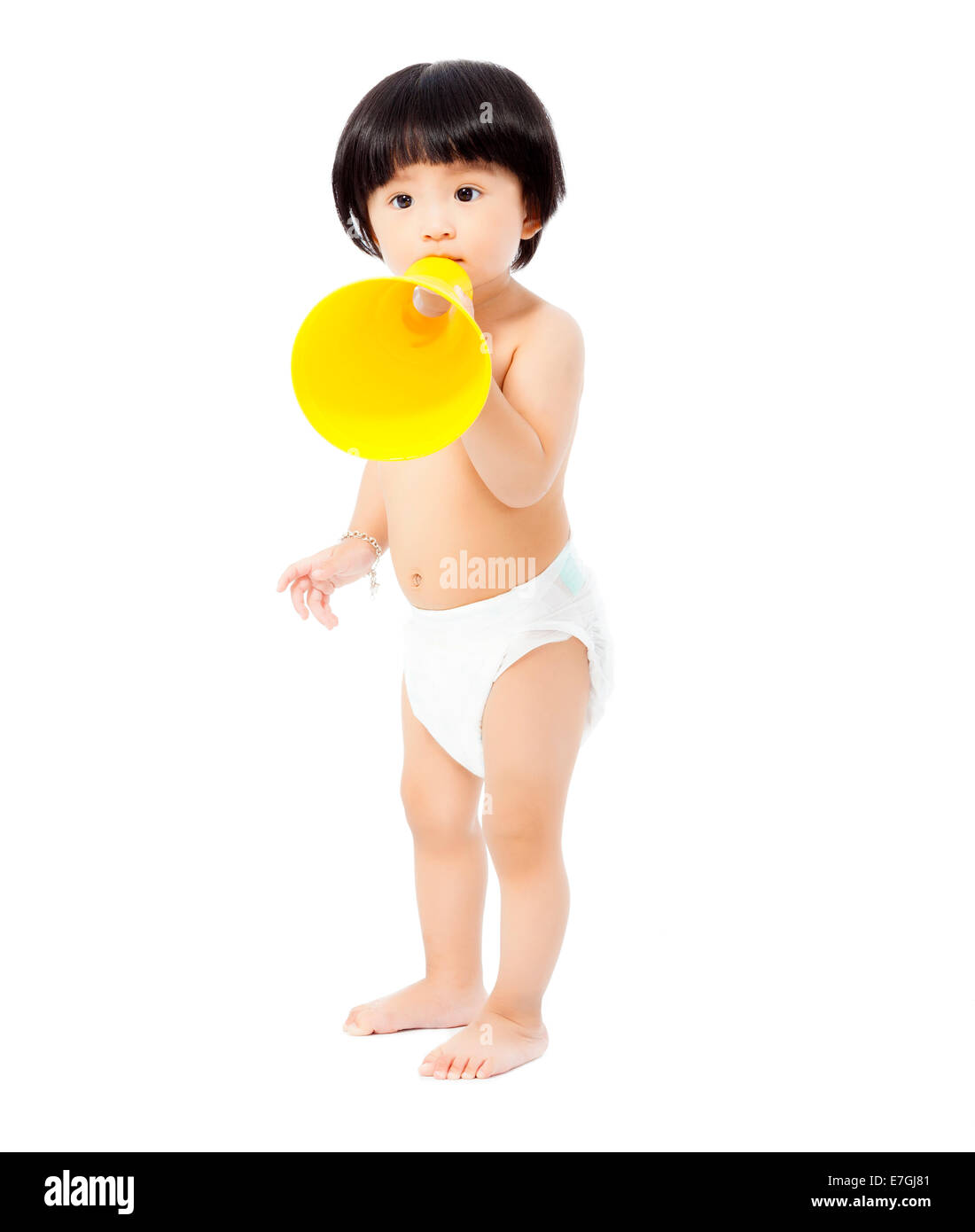 cute baby girl standing and holding a megaphone. isolated on white background Stock Photo