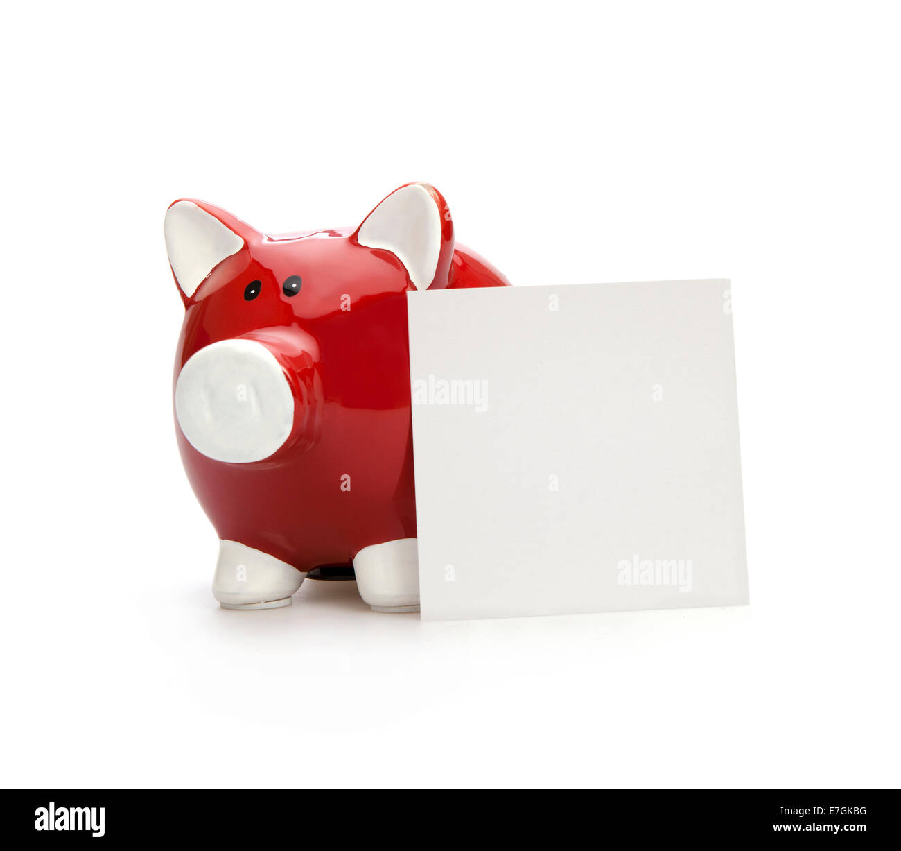 Piggy Bank and Blank Note Paper on the white background Stock Photo
