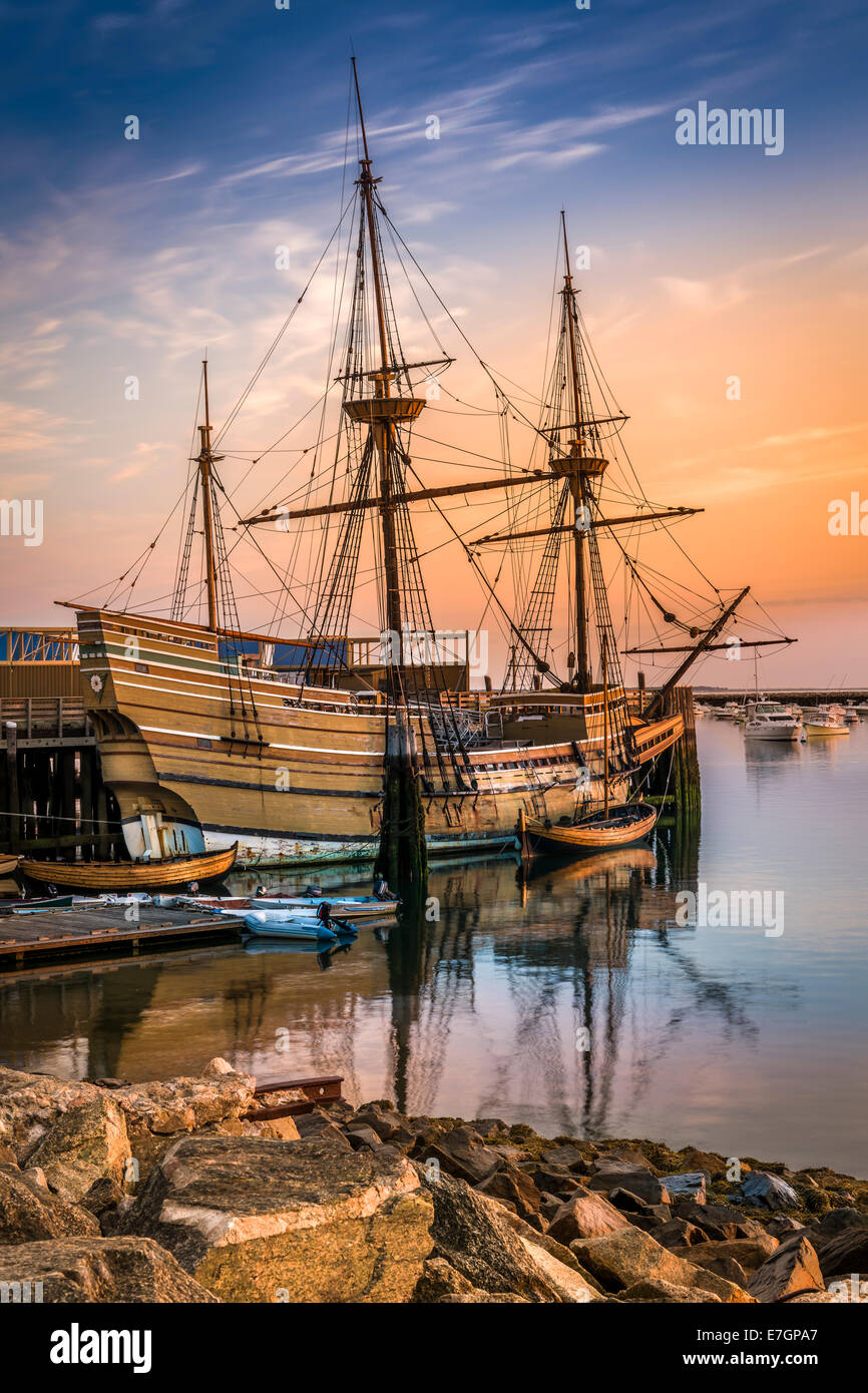 The sun rises over the Mayflower II, a replica of the 17th century Mayflower moored off State Pier in Plymouth, Massachusetts - Stock Photo