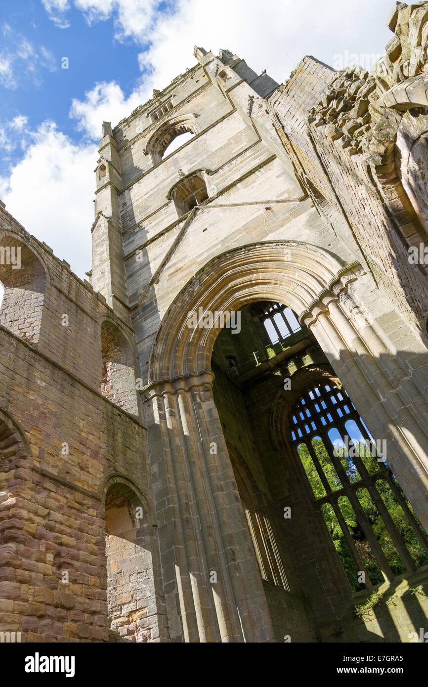 External of Fountains Abbey in Ripon, North Yorkshire with reflection in the water Stock Photo