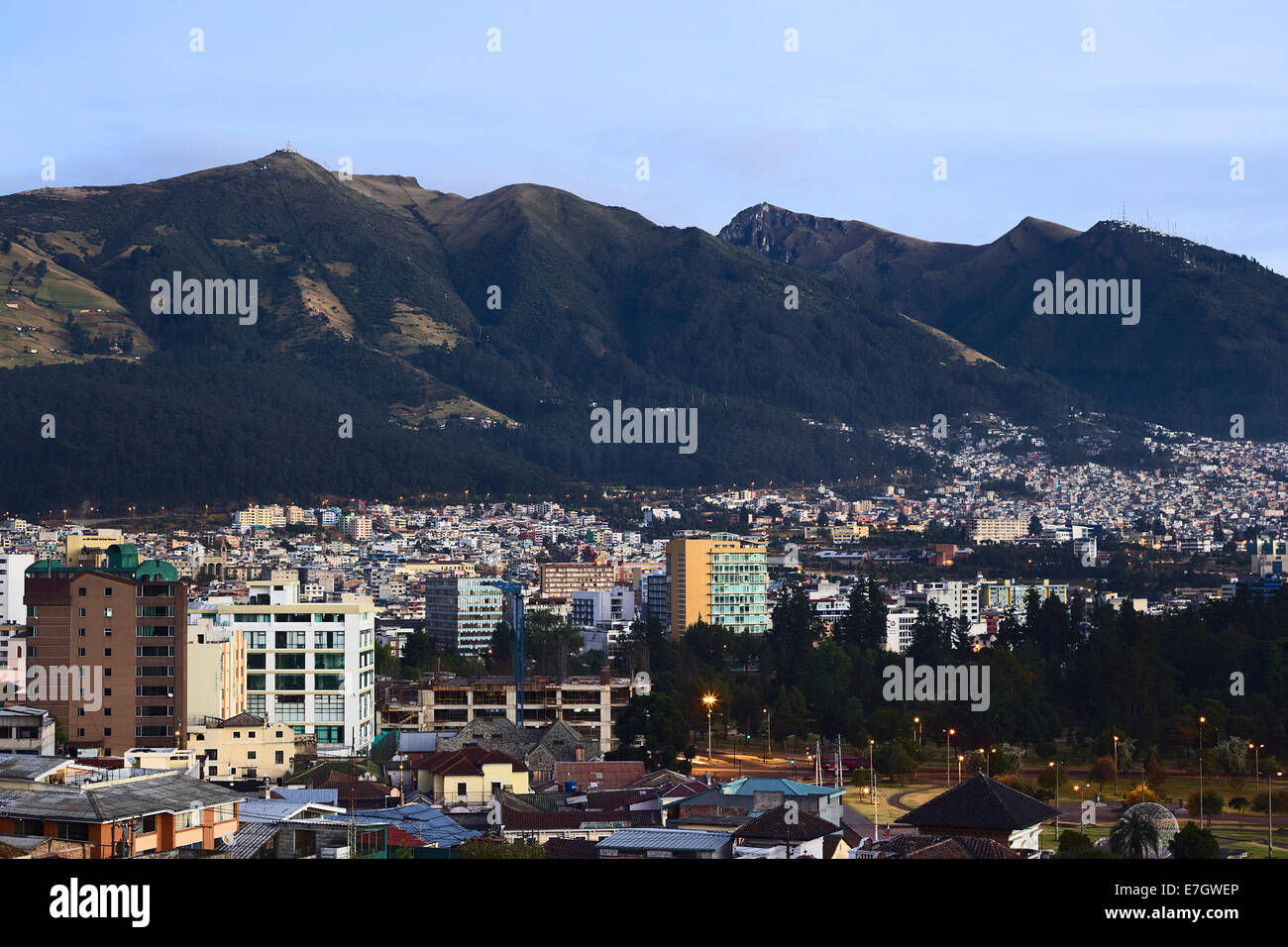 View over the parks Parque del Arbolito and El Ejido in the foreground and the Pichincha mountain in the back in Quito, Ecuador Stock Photo