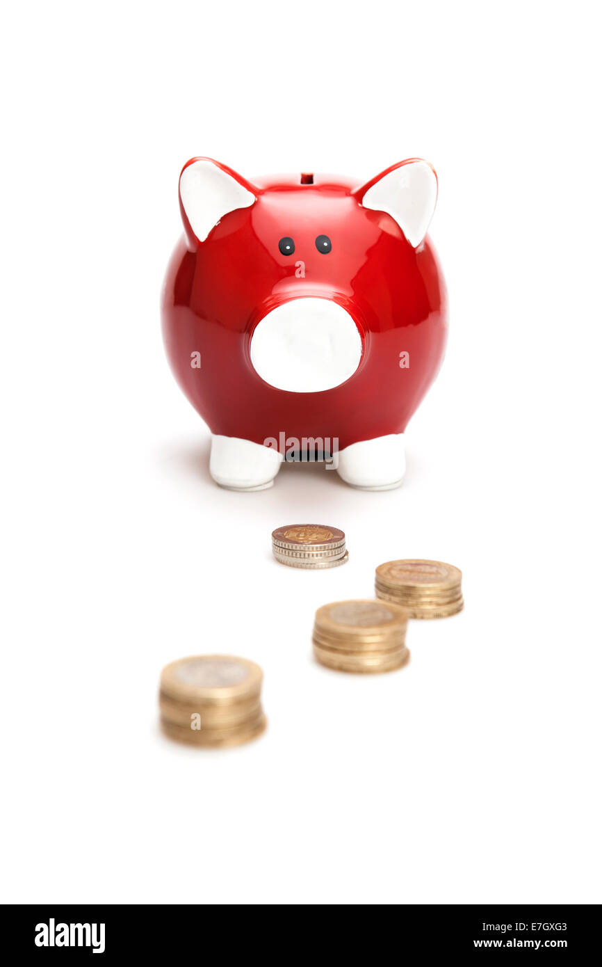 Piggy Bank with Coins on the white background. Isolated on white Stock Photo