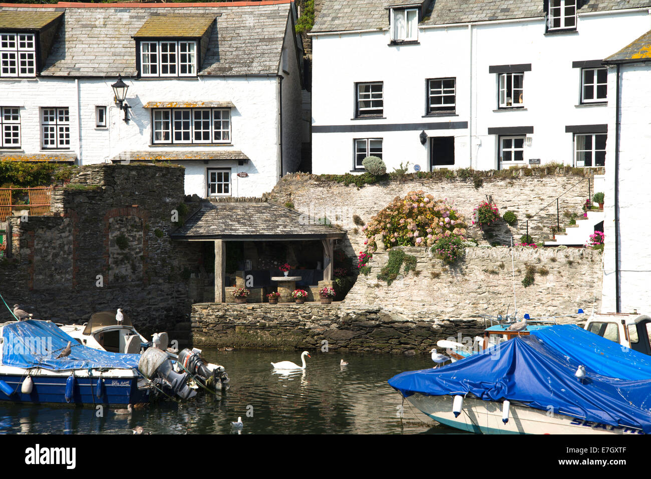 Traditional fishing village, Polperro in Cornwall, South West England with boats and houses Stock Photo