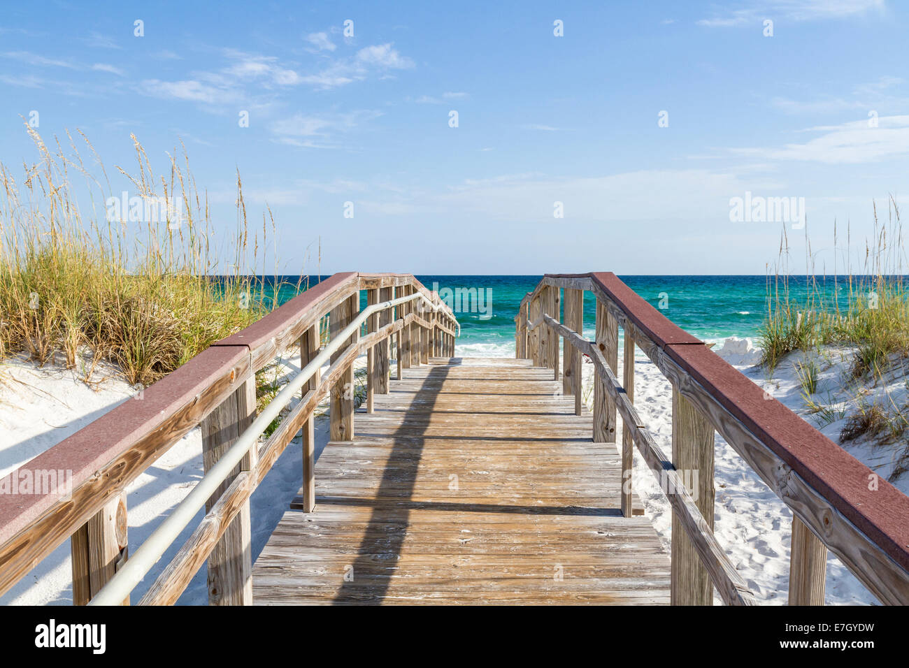 The boardwalk leads to the turquoise waters of the Gulf of Mexico at Park West on the western end of Pensacola Beach, Florida. Stock Photo