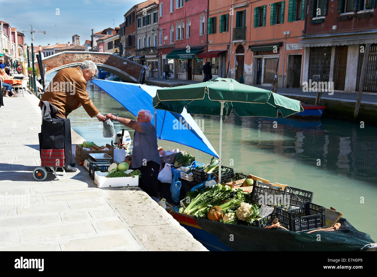 Local shopping for vegetables at a floating market in Murano, Venice
