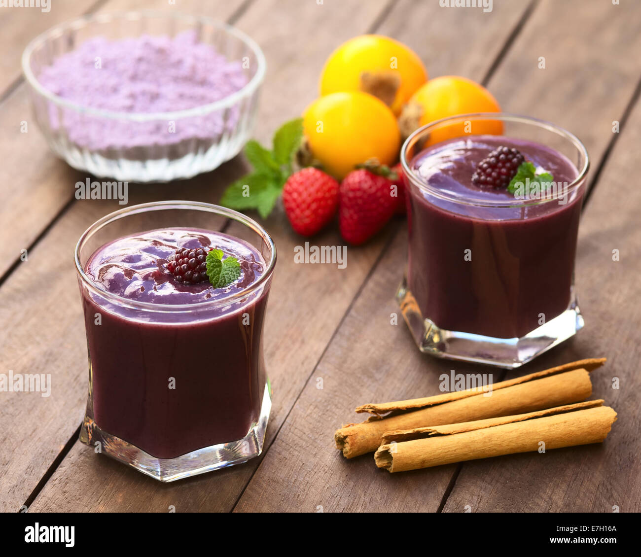 Ecuadorian traditional thick drink called Colada Morada, prepared by cooking purple corn flour and different fruits Stock Photo