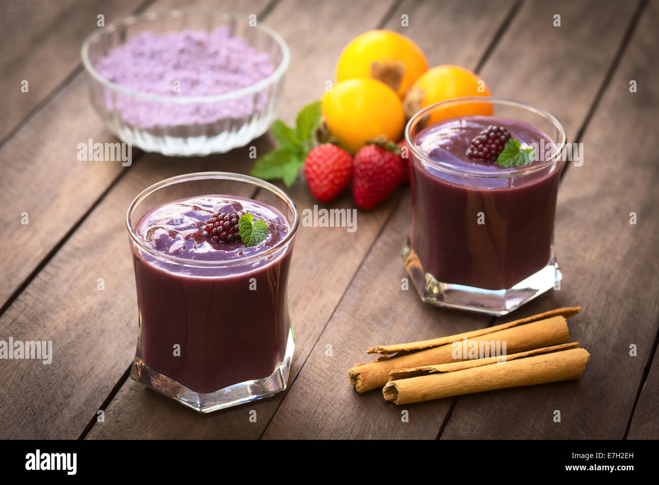Ecuadorian traditional thick drink called Colada Morada, prepared by cooking purple corn flour and different fruits Stock Photo