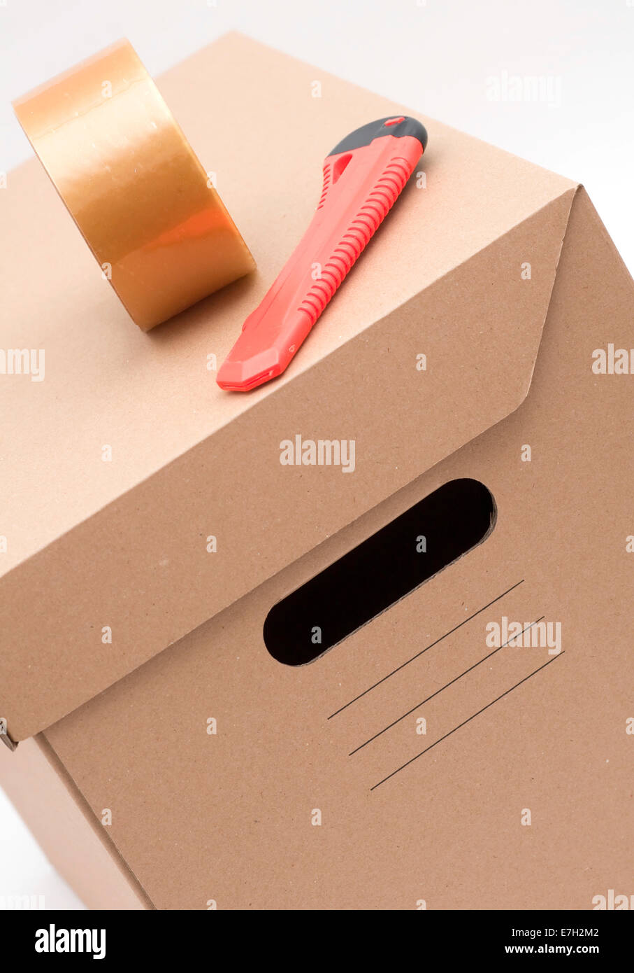 Cardboard box, cardboard cutter, adhesive tape Stock Photo Alamy
