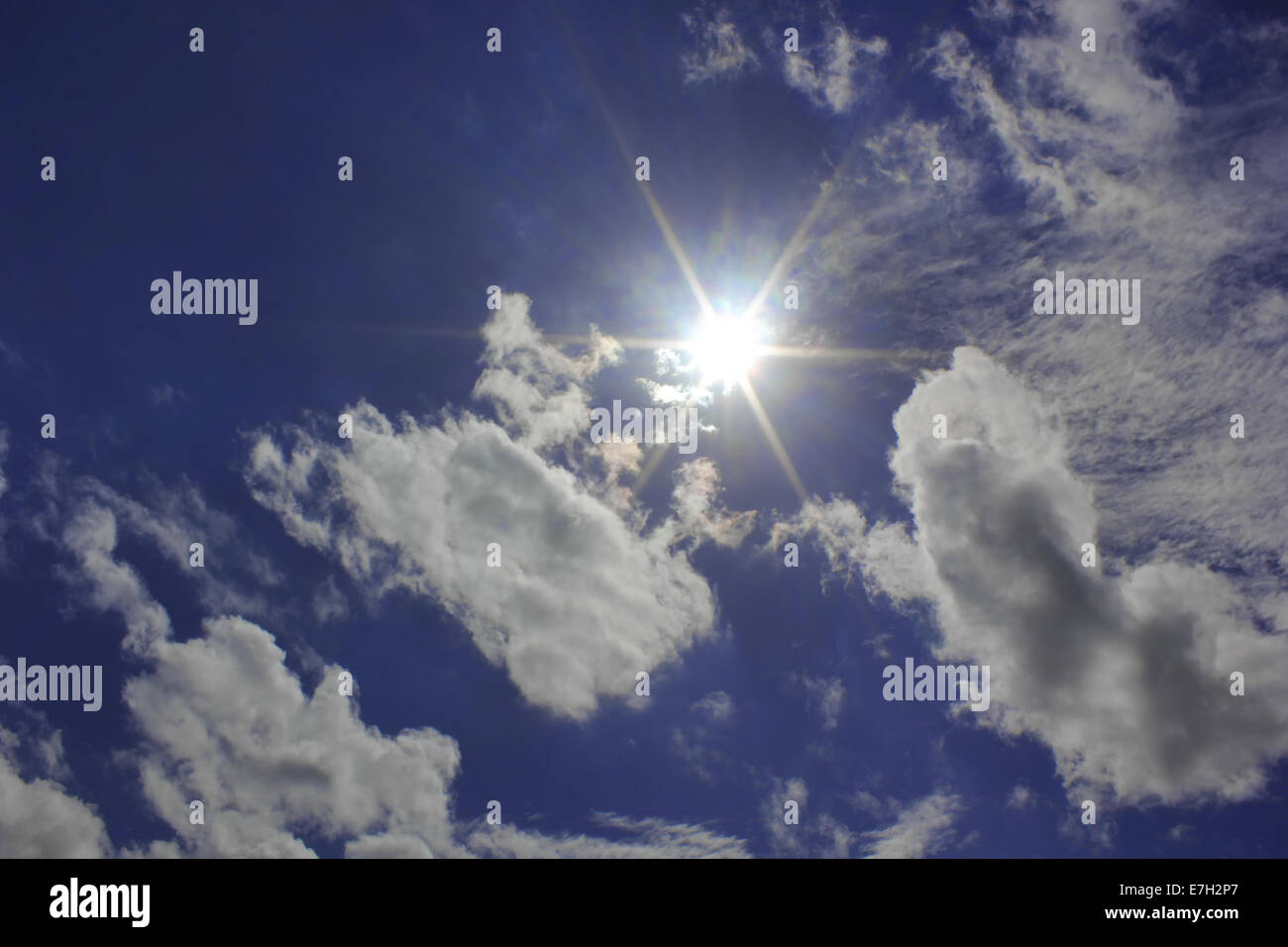 beautiful cloud on blue sky and the sun Stock Photo - Alamy