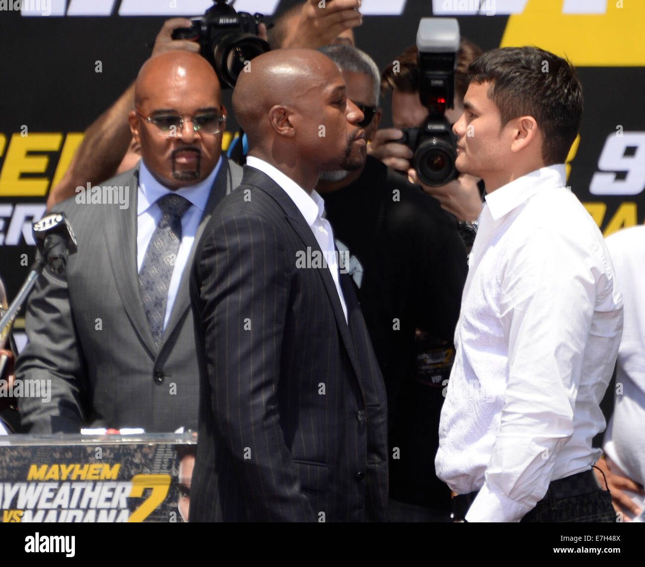 (L)Mayweather Promotions CEO Leonard Ellerbe seen at a LA press conference back on July 17, 2014