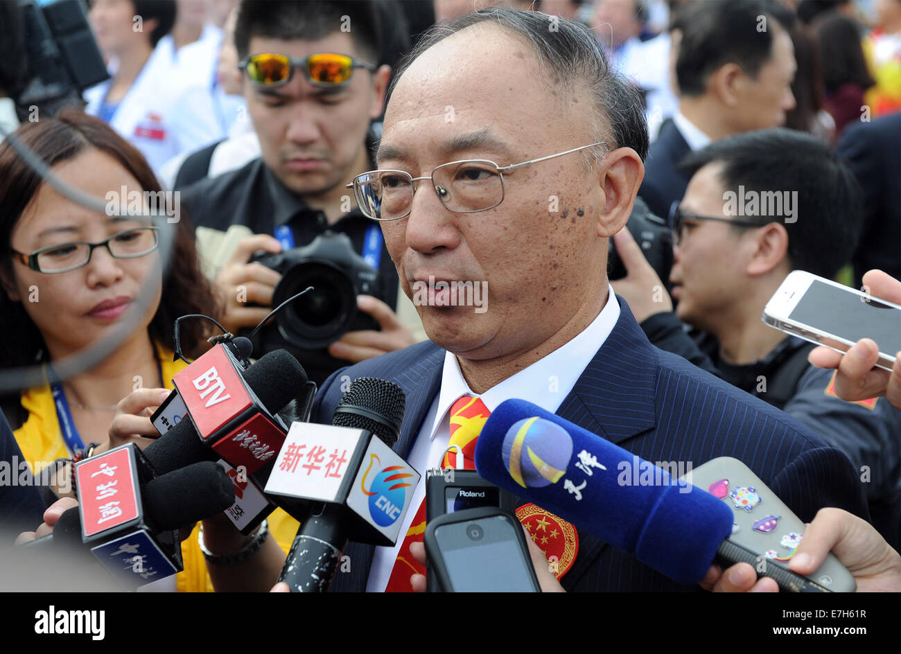 Incheon, South Korea. 18th Sep, 2014. Liu Peng, chef de mission of Team China, receives an interview after the flag-raising ceremony of the Chinese delegation at the Athletes' Village of the 17th Asian Games in Incheon, South Korea, Sept. 18, 2014. Credit:  Han Yuqing/Xinhua/Alamy Live News Stock Photo