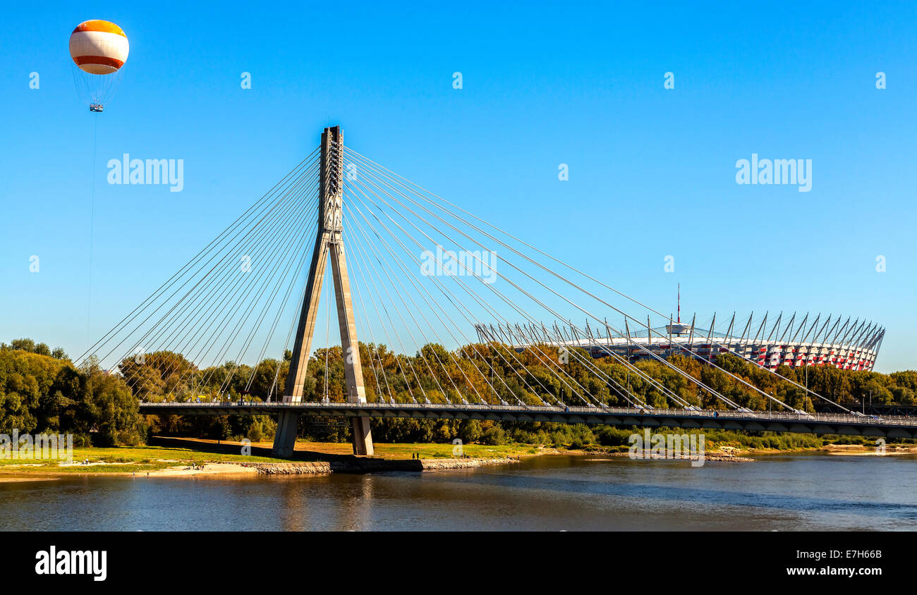 Bridge, hot-air balloon and stadium over Vistula river in Warsaw, Poland. Stock Photo