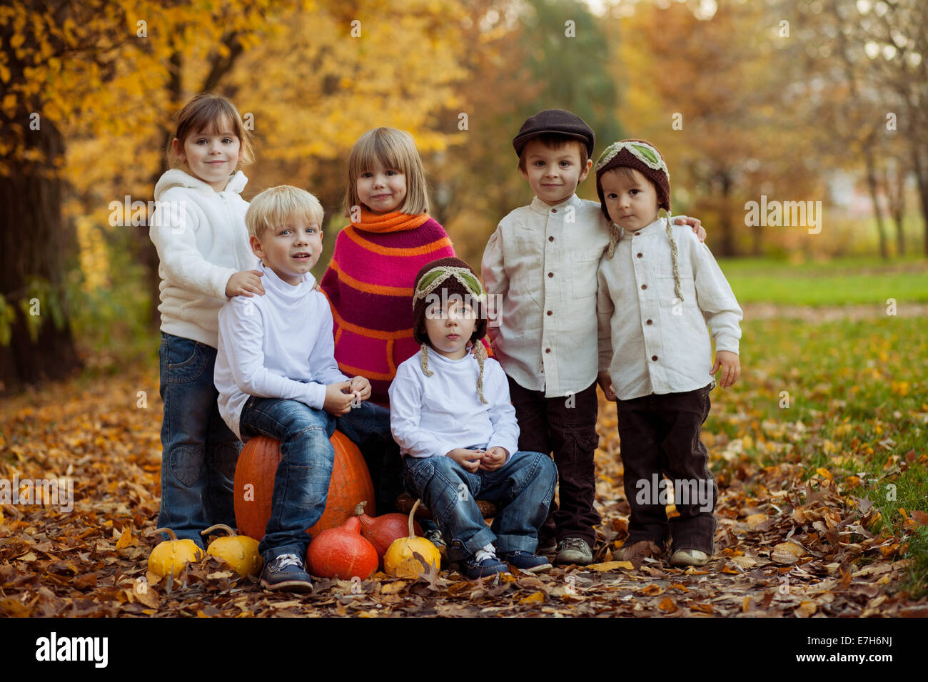 Autumn portrait of group of happy kids, outdoor in the park Stock Photo