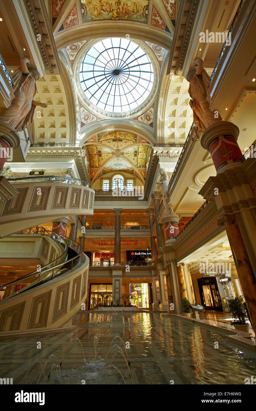 Spiral escalators and pool in the lobby of the Forum Shops, Caesars Palace, Las Vegas, Nevada, USA Stock Photo