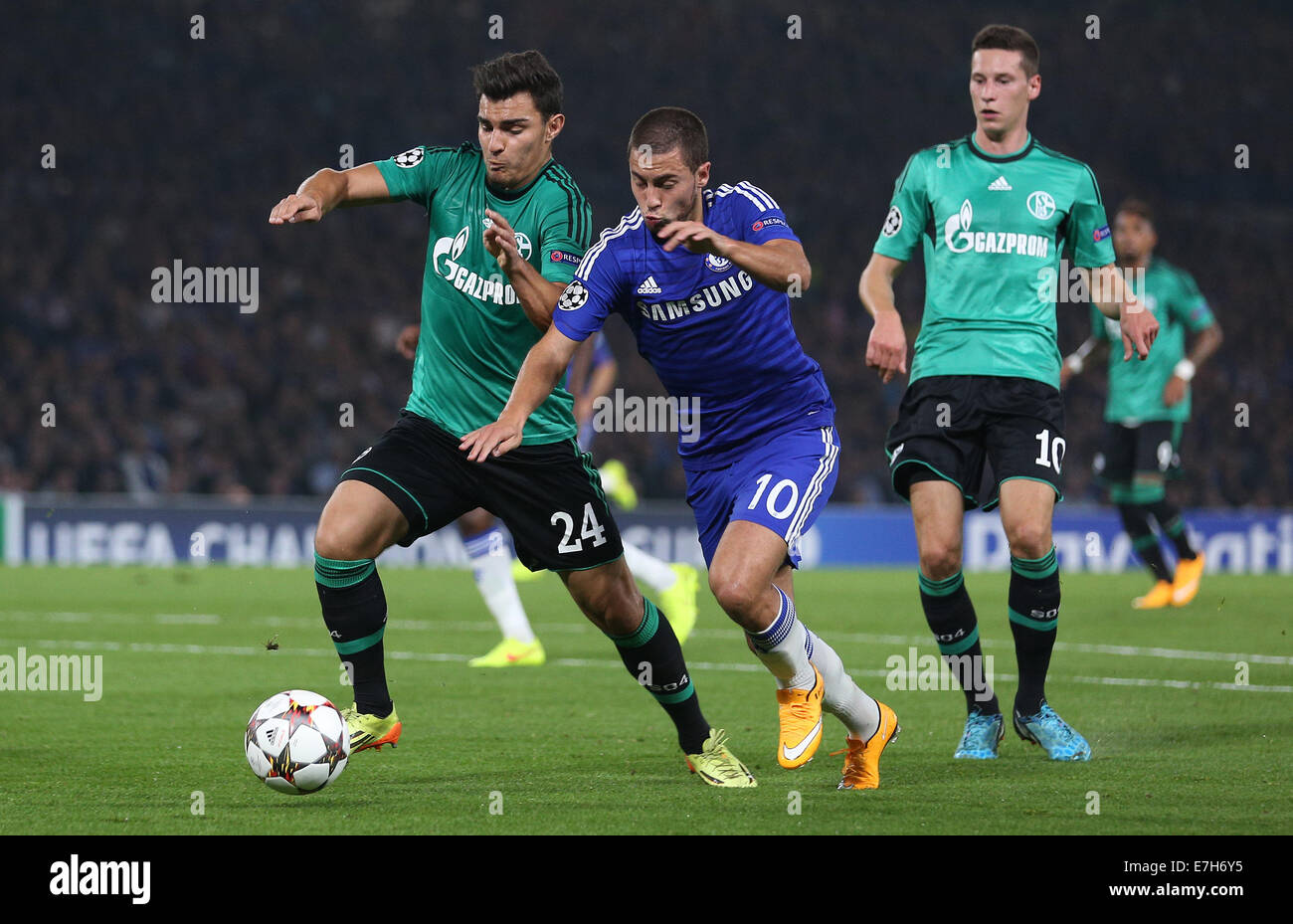 London, Britain. 17th Sep, 2014. Chelsea's Gary Cahill and Schalke's Kaan Ayhan (l) vie for the ball during the UEFA Champions League Group G soccer match between Chelsea FC and FC Schalke 04 at Stamford Bridge stadium in London, Britain, 17 September 2014. Photo: Ina Fassbender/dpa/Alamy Live News Stock Photo