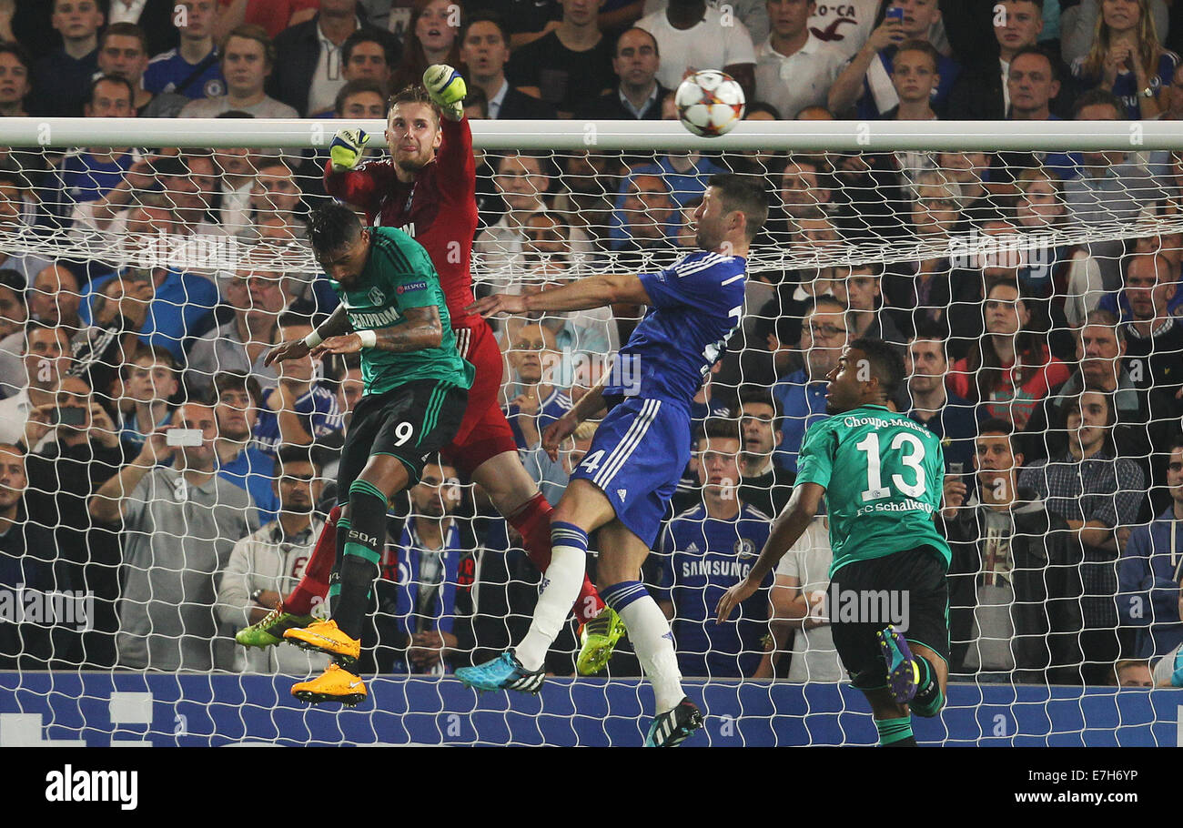 London, Britain. 17th Sep, 2014. Chelsea's Gary Cahill (2r), Schalke's Kevin-Prince Boateng (l) and Ralf Faehrmann jump for a ball during the UEFA Champions League Group G soccer match between Chelsea FC and FC Schalke 04 at Stamford Bridge stadium in London, Britain, 17 September 2014. Photo: Ina Fassbender/dpa/Alamy Live News Stock Photo