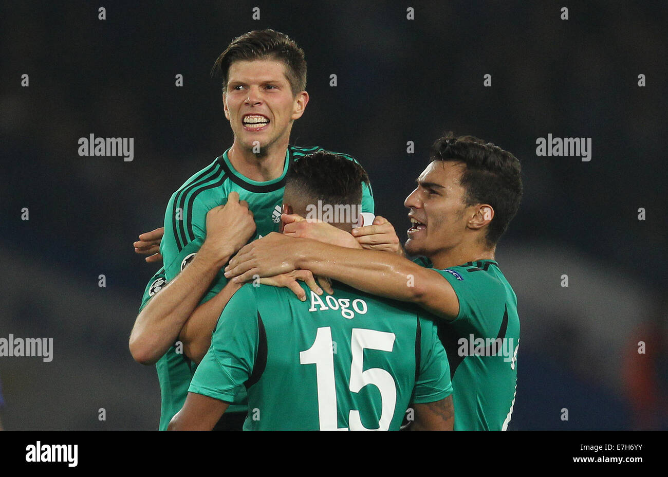London, Britain. 17th Sep, 2014. Schalke's Klaas-Jan Huntelaar (l), Dennis Aogo and Kaan Ayhan (r) celebrate a goal against Chelsea during the UEFA Champions League Group G soccer match between Chelsea FC and FC Schalke 04 at Stamford Bridge stadium in London, Britain, 17 September 2014. Photo: Ina Fassbender/dpa/Alamy Live News Stock Photo