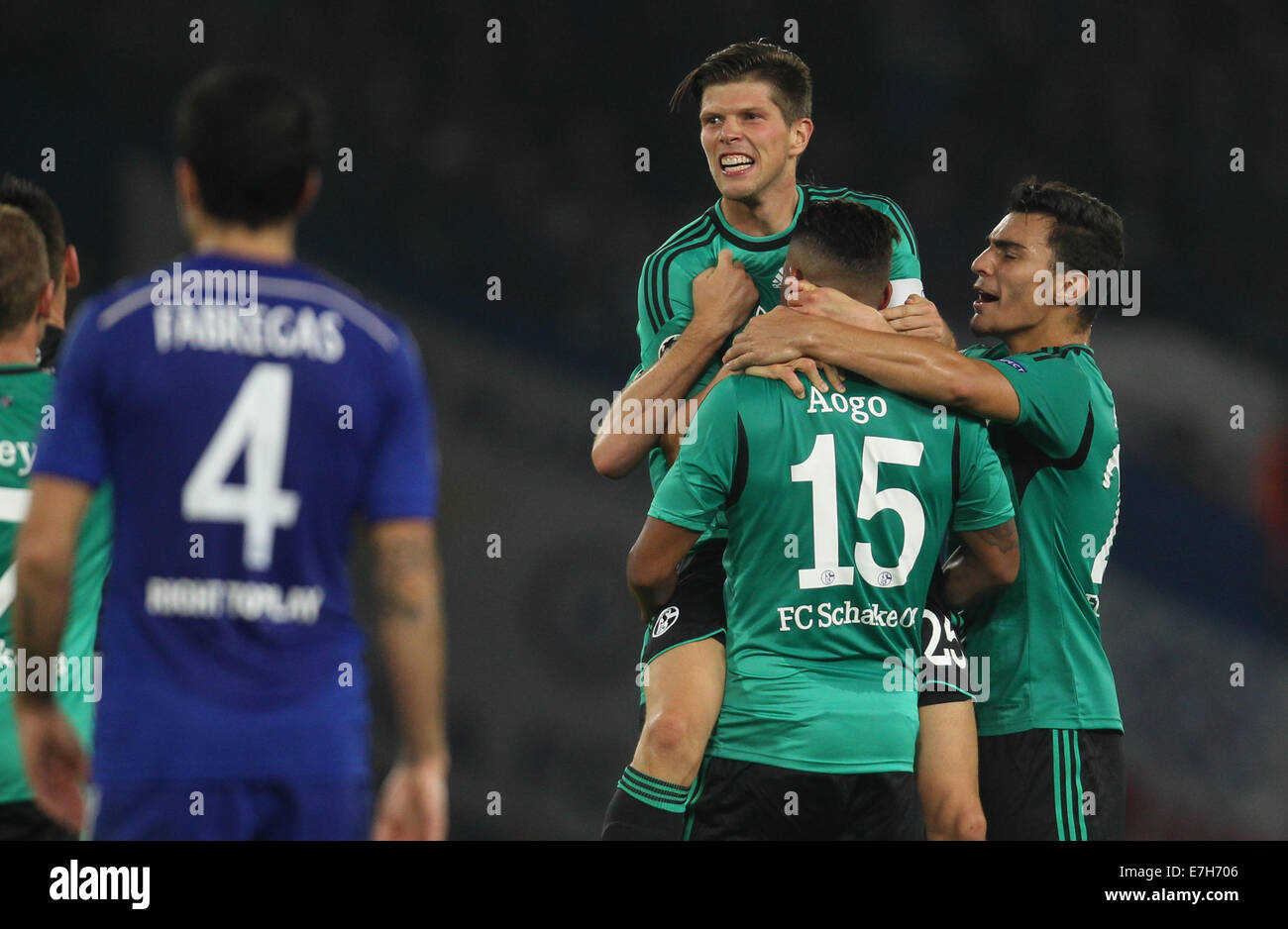 London, Britain. 17th Sep, 2014. Schalke's Klaas-Jan Huntelaar (l), Dennis Aogo and Kaan Ayhan (r) celebrate a goal against Chelsea during the UEFA Champions League Group G soccer match between Chelsea FC and FC Schalke 04 at Stamford Bridge stadium in London, Britain, 17 September 2014. Photo: Ina Fassbender/dpa/Alamy Live News Stock Photo