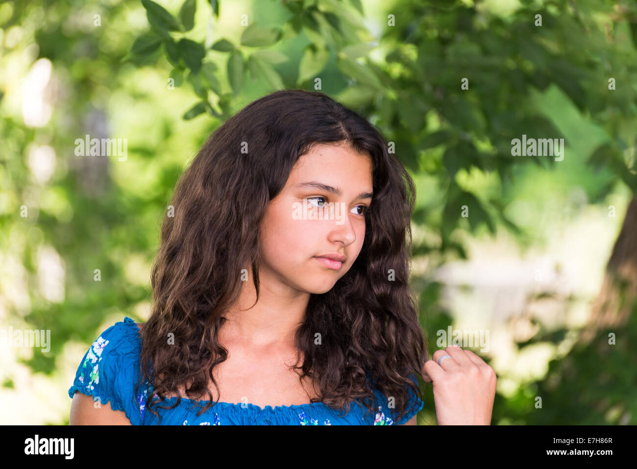 Beautiful girl in a park on summer day Stock Photo - Alamy
