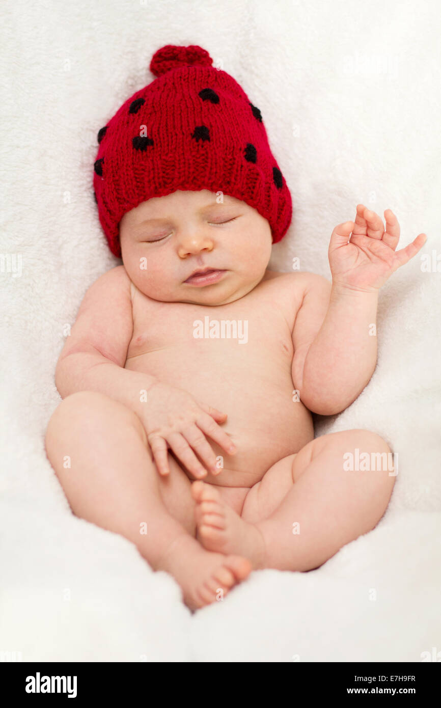 Baby girl with a ladybug hat Stock Photo