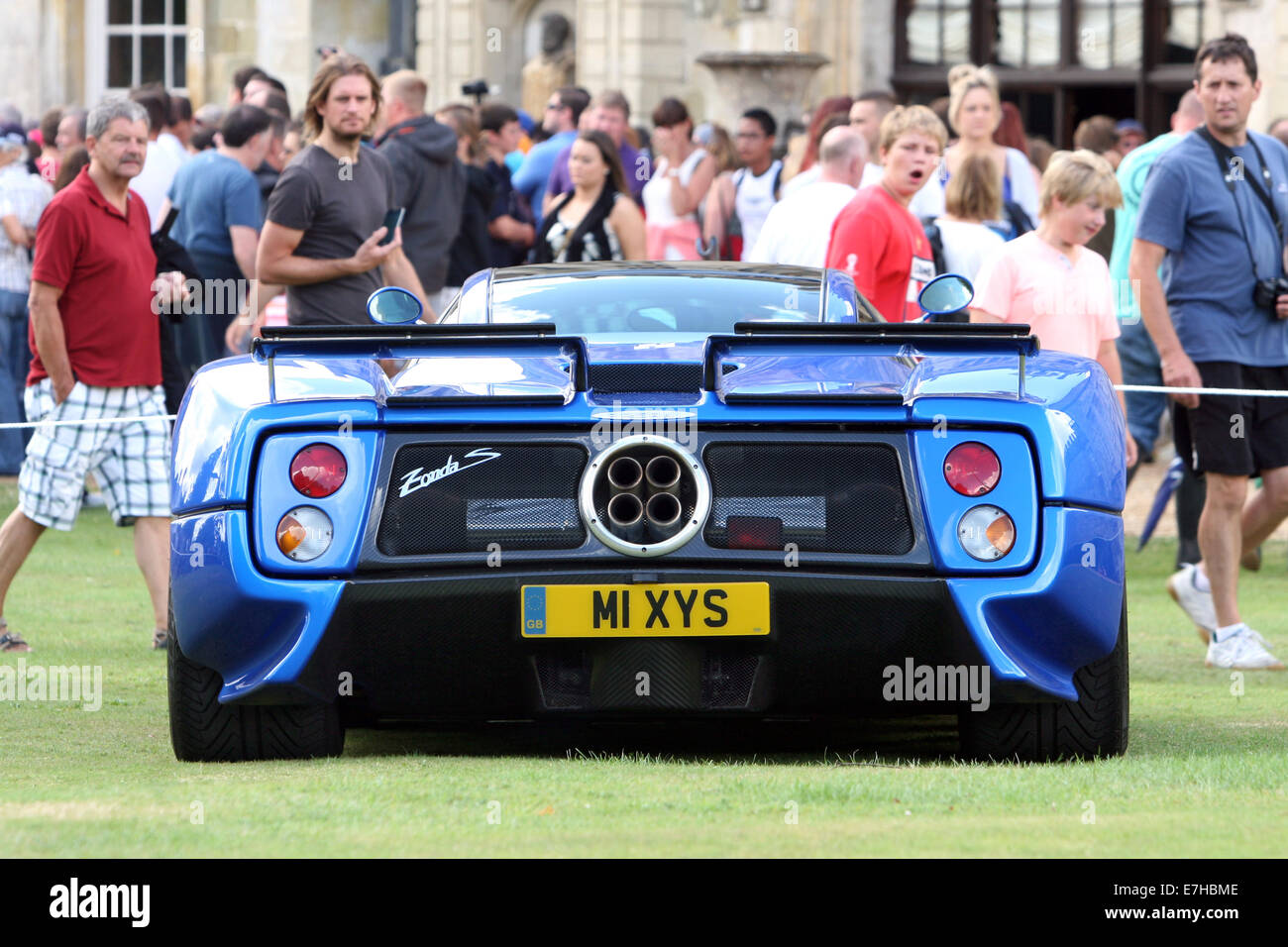 A  2003 Pagani Zonda C12 S in electric blue draws attention at a summer car show in Wiltshire. England. Stock Photo