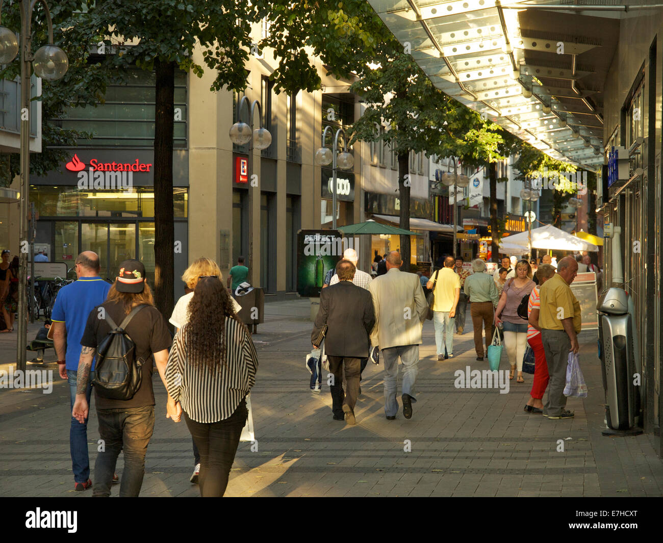 Shopping street in the late afternoon sunlight, Cologne city center, NRW, Germany Stock Photo