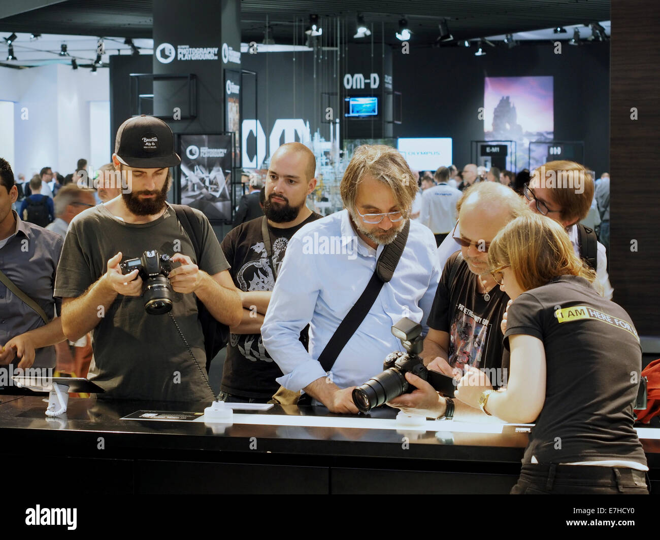 Men with beards looking at Nikon DSLR camera's at the 2014 Photokina in Cologne, Germany Stock Photo