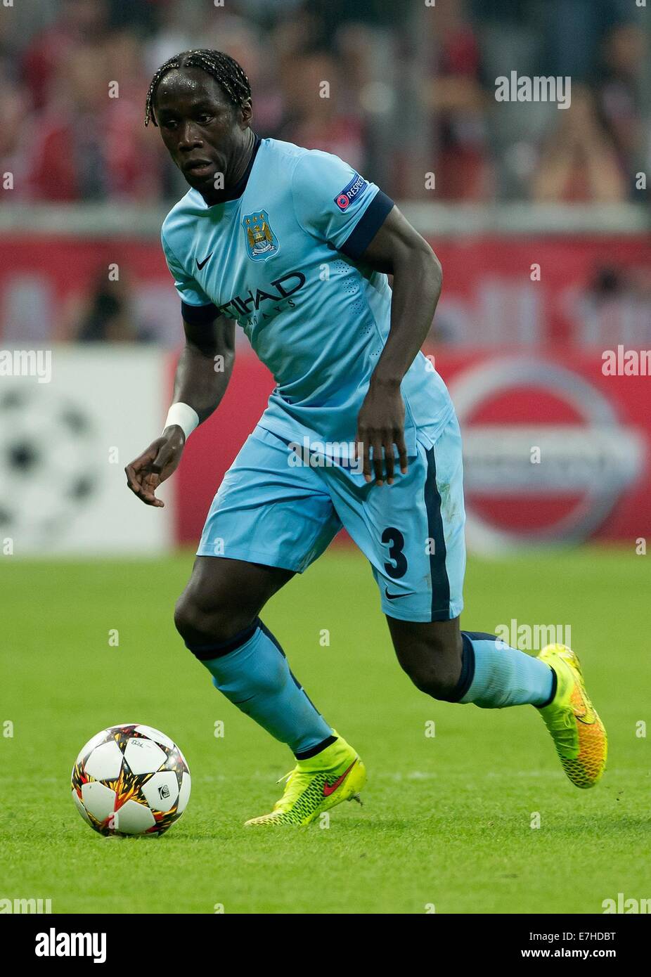 Munich, Germany. 17th Sep, 2014. Manchester's Bacary Sagna controls the ball during the UEFA Champions League Group E soccer match between FC Bayern Munich and Manchester City in Munich, Germany, 17 September 2014. Photo: Sven Hoppe/dpa/Alamy Live News Stock Photo