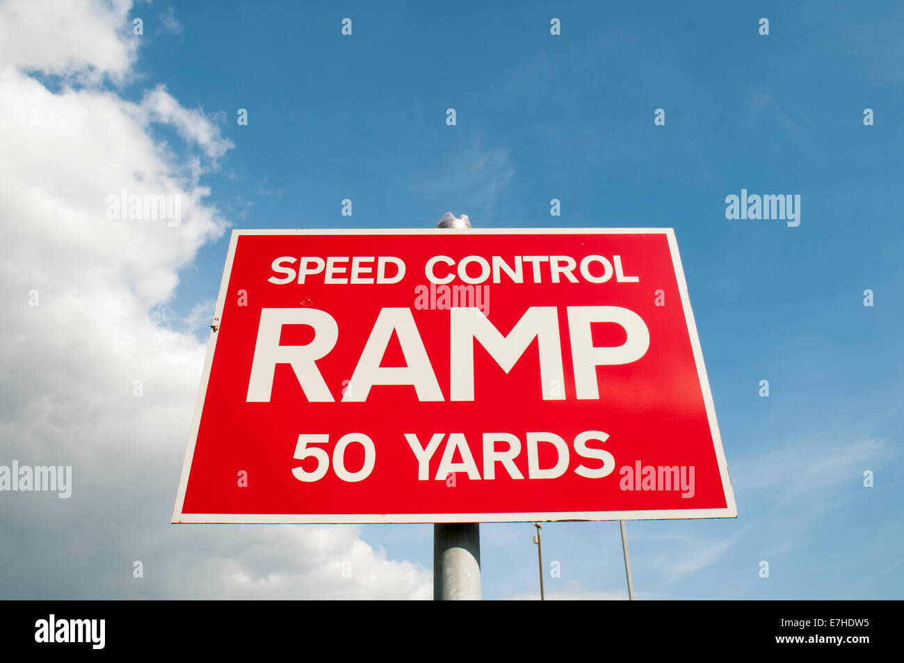 red speed control ramp 50 yards sign on a post Stock Photo