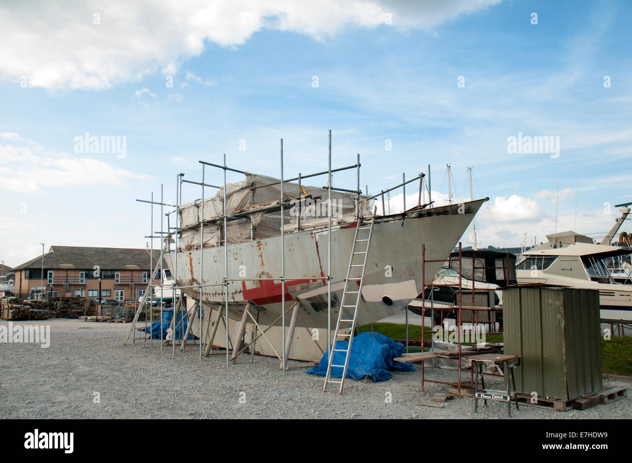 steel yacht being renovated in a boatyard Stock Photo