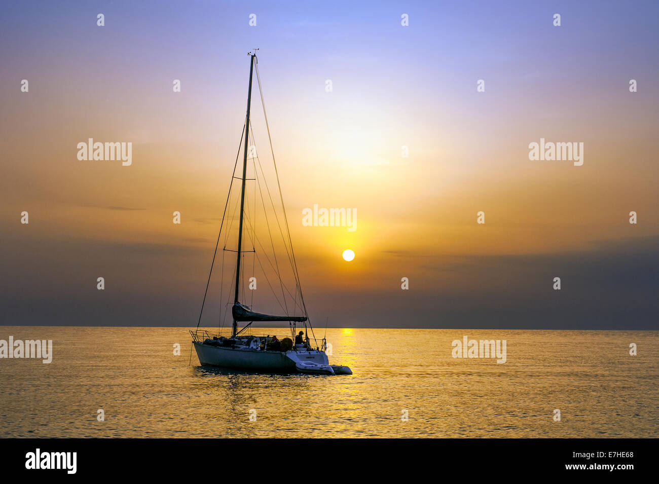 Europe, France, Corsica, Haute Corse, Cap Corse. Nonza. Anchored sailboat at dusk. Stock Photo