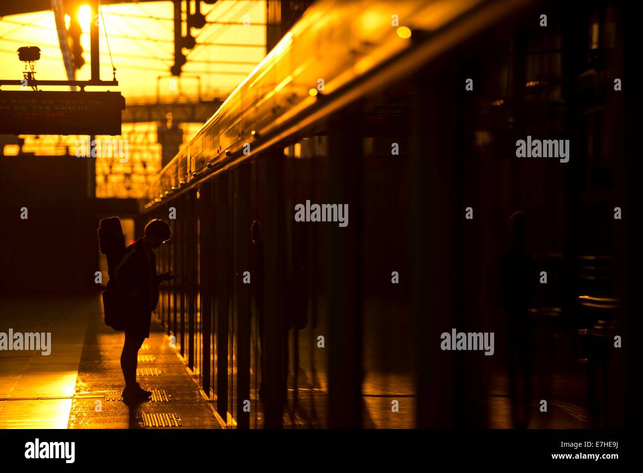 Incheon, South Korea. 18th Sep, 2014. A citizen waits for metro train at a station in Incheon, South Korea, Sept. 18, 2014. Incheon is the third populous city of South Korea. It is also the third city of the country to host major sports event of Asia. The opening ceremony of the 17th Asian Games will be held in Incheon on Sept. 19. Credit:  Lui Siu Wai/Xinhua/Alamy Live News Stock Photo