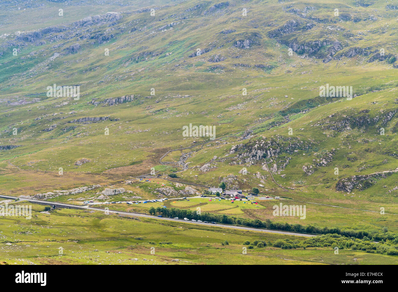 High view to Willie's Farm campsite beside the A5 road in Ogwen Valley from Carneddau mountains in Snowdonia National Park Wales Stock Photo